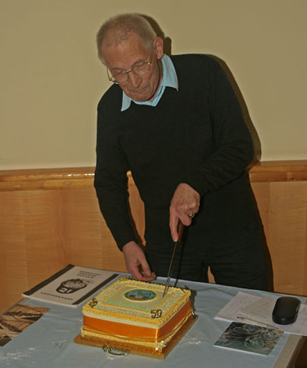 Alasdair Glen cutting the cake
