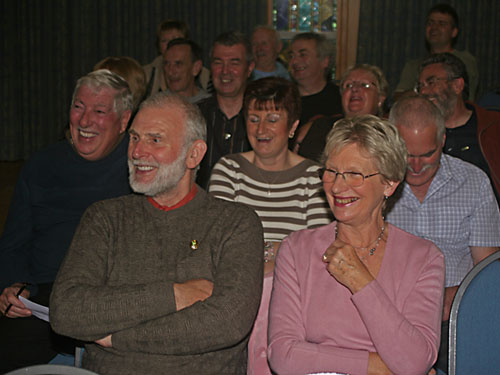 The audience enjoying a joke