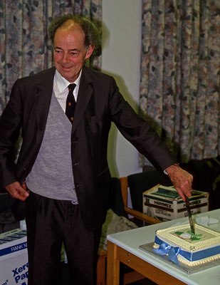 Bill Maddams cutting the cake